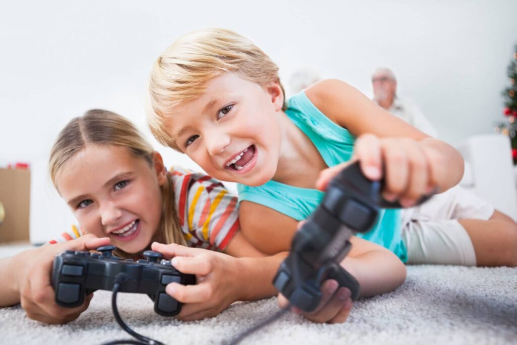 Children playing video games created in our game programming after school program.